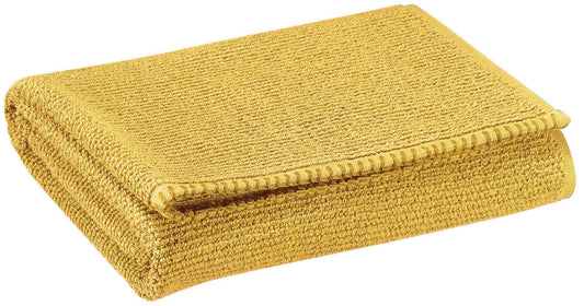 asciugamano bora curry, colore curry, taglia 50 x 100. asciugamano piegato su sfondo neutro per una visione pulita del prodotto