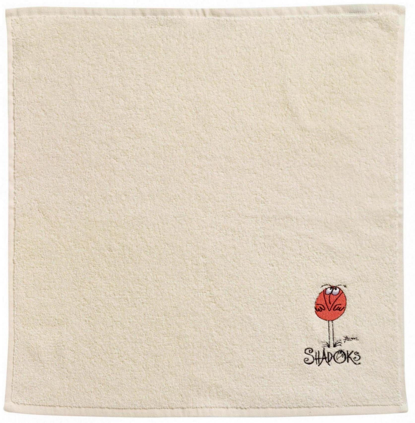 asciugamano quadrato shadoks avorio, colore avorio, taglia 50 x 50. asciugamano piegato su sfondo neutro per una visione pulita del prodotto