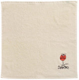 asciugamano quadrato shadoks avorio, colore avorio, taglia 50 x 50. asciugamano piegato su sfondo neutro per una visione pulita del prodotto