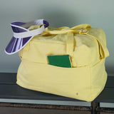 borsa da viaggio iona luce del sole, colore luce del sole, taglia 30 x 42 x 20. realizzata in 100% cotone bio, pensata per viaggiare con stile e sostenibilità