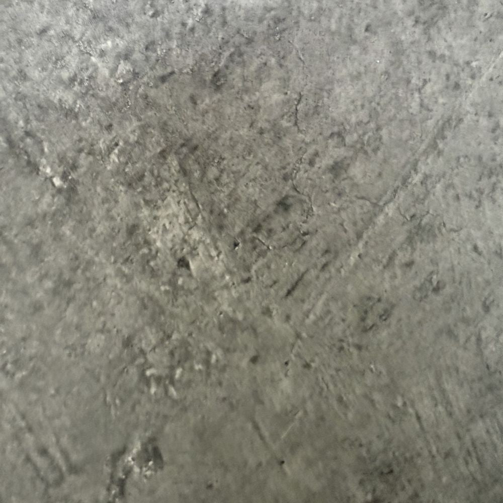 consolle allungabile ofelia colore grigio cemento, vista laterale per evidenziare il sistema di estensione