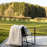 plaid noam neve, colore neve, taglia 140 x 180. aggiunge comfort e stile alla zona notte