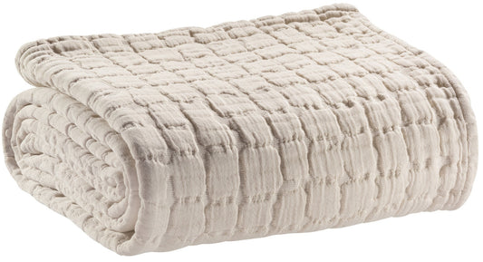 plaid swami lino, colore lino, taglia 130 x 200. vista frontale della coperta piegata su sfondo bianco