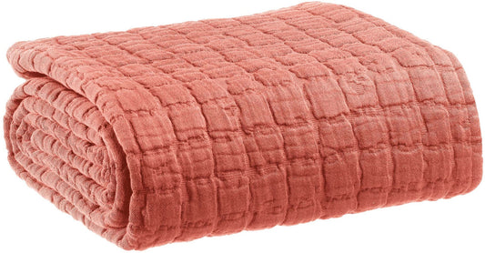 plaid jacquard jane pesca, colore pesca, taglia 130 x 200. vista frontale della coperta piegata su sfondo bianco