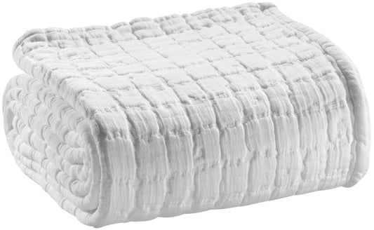 coperta swami bianco, colore bianco, taglia 180 x 260. vista frontale della coperta piegata su sfondo bianco