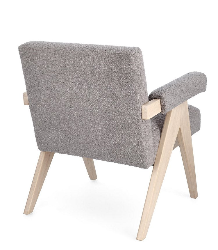 poltrona faiza in tessuto effetto bouclé tortora e gambe in legno rubberwood, perfetta per aggiungere comfort ed eleganza...