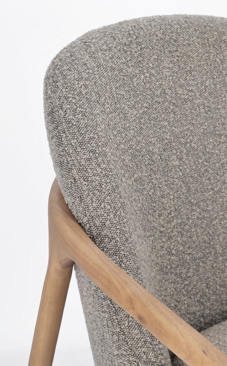 poltrona elaide in tessuto effetto bouclé grigio e struttura in legno rubberwood, ideale per creare un angolo relax in casa