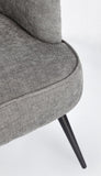 poltrona ernestine in tessuto grigio scuro e gambe in acciaio verniciato nero, ideale per creare un angolo relax in casa