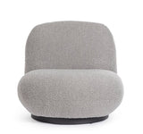 poltrona girevole margot in tessuto effetto bouclé grigio, vista ambientata in soggiorno o angolo lettura