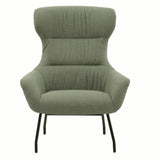 poltrona haiti in tessuto verde e gambe in metallo nero, dettaglio del rivestimento in tessuto o velluto