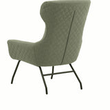 poltrona haiti in tessuto verde e gambe in metallo nero, stile contemporaneo con braccioli comodi e seduta avvolgente