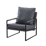 poltrona gimmy in ecopelle grigio scuro e struttura in metallo nero, vista ambientata in soggiorno o angolo lettura