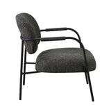 poltrona nat con struttura in metallo nero e seduta in tessuto teddy grigio scuro, perfetta per aggiungere comfort ed eleganza all’arredamento