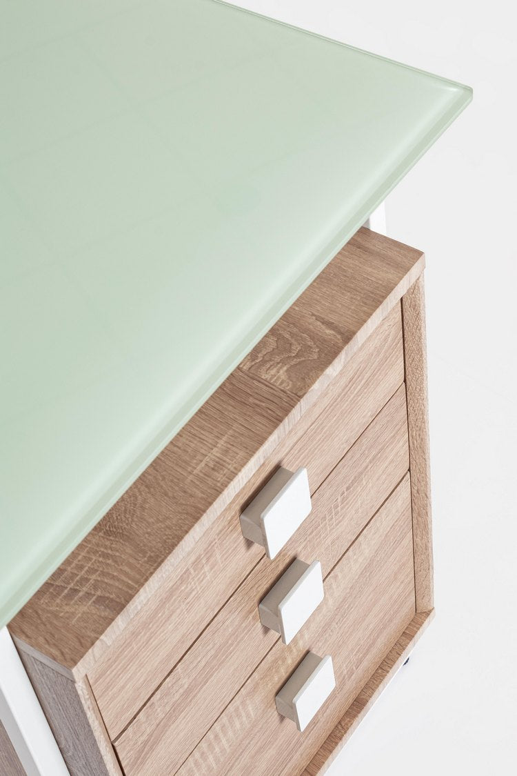 scrivania thomas in vetro temperato e base acciaio bianco, con cassettiera 142 x 69 cm, ambientazione d’arredo con il...