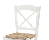 set di 2 sedie tiburtina in legno massello bianco con seduta in paglia, vista ambientata attorno a un tavolo da pranzo