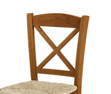 set di 2 sedie tiburtina in legno massello noce con seduta in paglia, vista ambientata attorno a un tavolo da pranzo