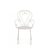 set di 4 sedie etienne in acciaio beige impilabili, con braccioli, ambientazione su terrazza, veranda o prato