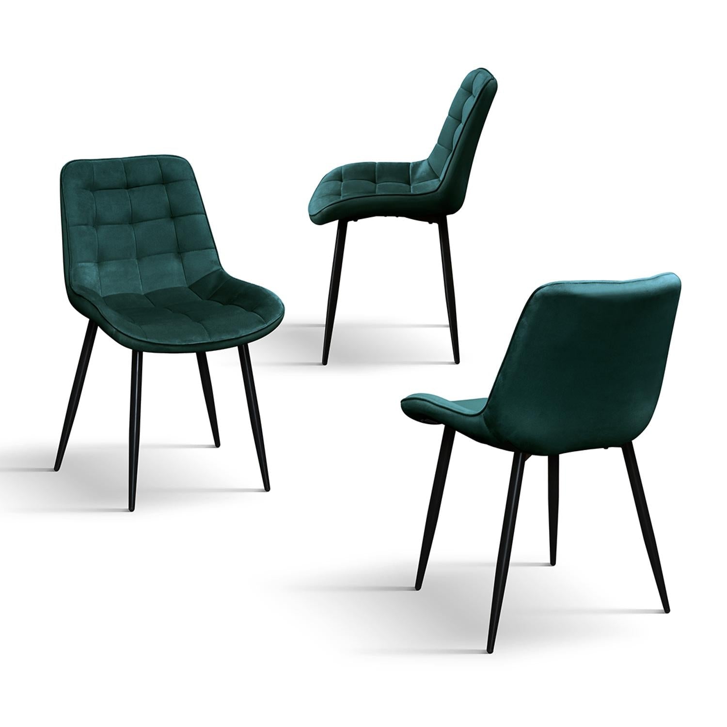 set di 4 sedie barcellona rivestite in velluto verde scuro e gambe in metallo nero, vista ambientata attorno a un tavolo da...