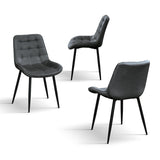 set di 4 sedie barcellona rivestite in velluto grigio e gambe in metallo nero, vista ambientata attorno a un tavolo da pranzo