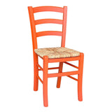 sedia venezia colore anilina arancio in legno di faggio con seduta in paglia, vista ambientata in sala da pranzo o rustico moderno