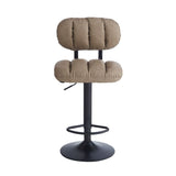 sgabello tati con seduta in ecopelle tortora e gamba in metallo nero, vista ambientata accanto a bancone o isola