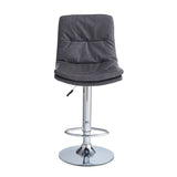 sgabello paco con seduta in ecopelle grigio e gamba in metallo inox, vista ambientata accanto a bancone o isola