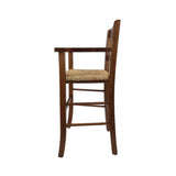 sediolone bimbo 708 legno noce e seduta paglia, vista ambientata accanto a bancone o isola