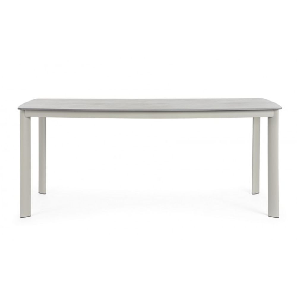 tavolo fisso alcora in pietra naturale e struttura in alluminio beige 180×90 cm, ambientazione in giardino con sedie...