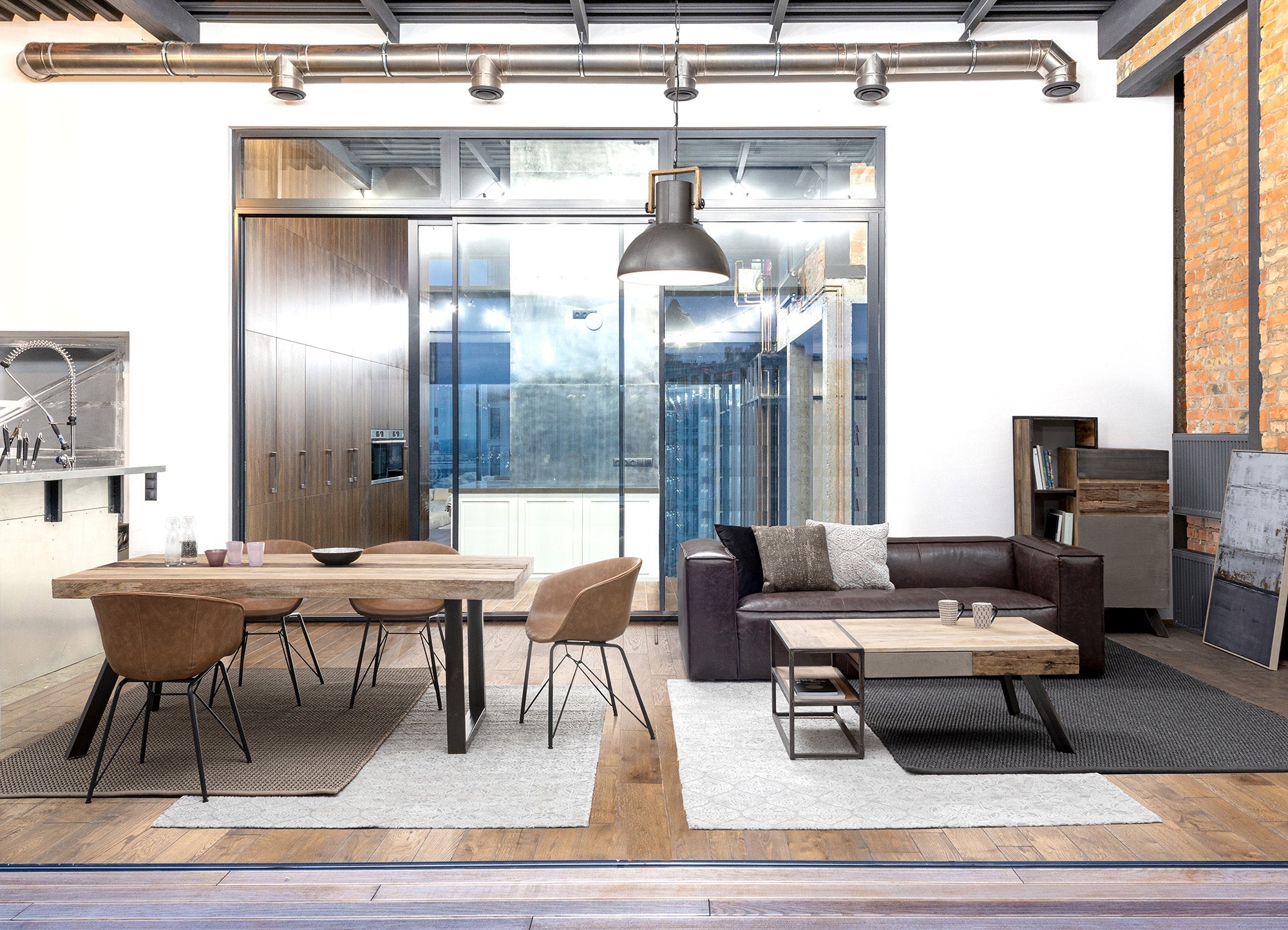 tavolo manchester in legno di mango e gambe in acciaio nero, 200×100, ambientazione d’arredo con il prodotto protagonista