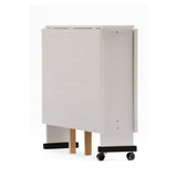 tavolo salvaspazio trio pieghevole 140x90x78 cm colore bianco frassinato, vista ambientata in spazi open space moderni