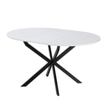 tavolo rotondo allungabile rut con piano colore bianco e gambe in metallo nero, vista ambientata in sala da pranzo elegante