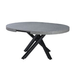 tavolo allungabile raven con piano colore cemento e gambe in metallo nero, vista ambientata in sala da pranzo elegante