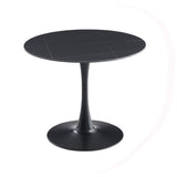 tavolo rotondo dot con piano in ceramica effetto marmo nero opaco con particolari oro e gamba nera, forma accogliente che favorisce la socialità