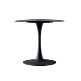 tavolo rotondo dot con piano in ceramica effetto marmo nero opaco con particolari oro e gamba nera, perfetto per piccoli gruppi o colazioni in famiglia