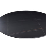 tavolo rotondo dot con piano in ceramica effetto marmo nero opaco con particolari oro e gamba nera, arredo raffinato per ambienti classici o moderni