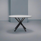 tavolo tondo logan con piano cemento e gambe in metallo nero φ120*76.5 cm., tavolo rotondo ideale per conversazioni conviviali