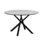 tavolo tondo logan con piano cemento e gambe in metallo nero φ120*76.5 cm., dettaglio del piano circolare e supporto centrale