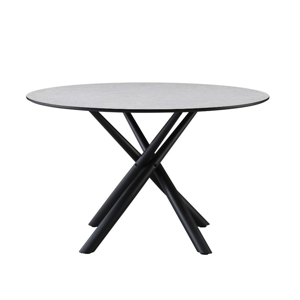 tavolo tondo logan con piano cemento e gambe in metallo nero φ120*76.5 cm., vista ambientata in sala da pranzo elegante