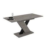 Tavolo allungabile Axi in cemento con dettaglio nero