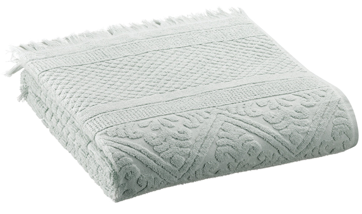 asciugamano zoe giada, colore giada, taglia 50 x 100. asciugamano piegato su sfondo neutro per una visione pulita del prodotto