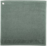 asciugamano con occhiello curl verde grigio, colore verde grigio, taglia 50 x 50. asciugamano piegato su sfondo neutro per una visione pulita del prodotto