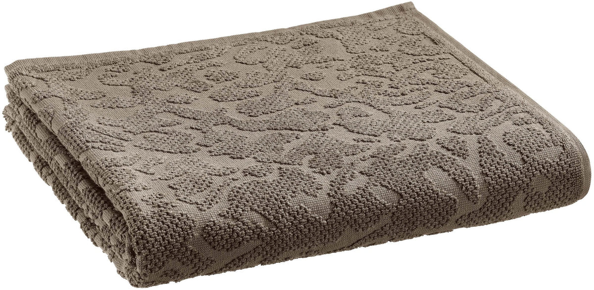 asciugamano doccia gilda carbone, colore carbone, taglia 70 x 130. asciugamano piegato su sfondo neutro per una visione pulita del prodotto