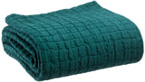 coperta swami olio, colore olio, taglia 180 x 260. vista frontale della coperta piegata su sfondo bianco