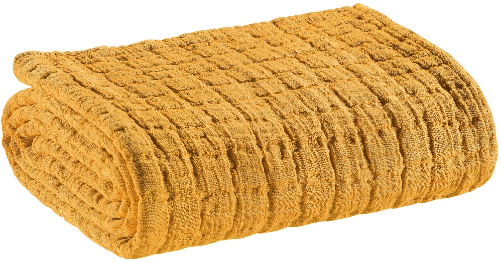 coperta swami zafferano, colore zafferano, taglia 180 x 260. vista frontale della coperta piegata su sfondo bianco