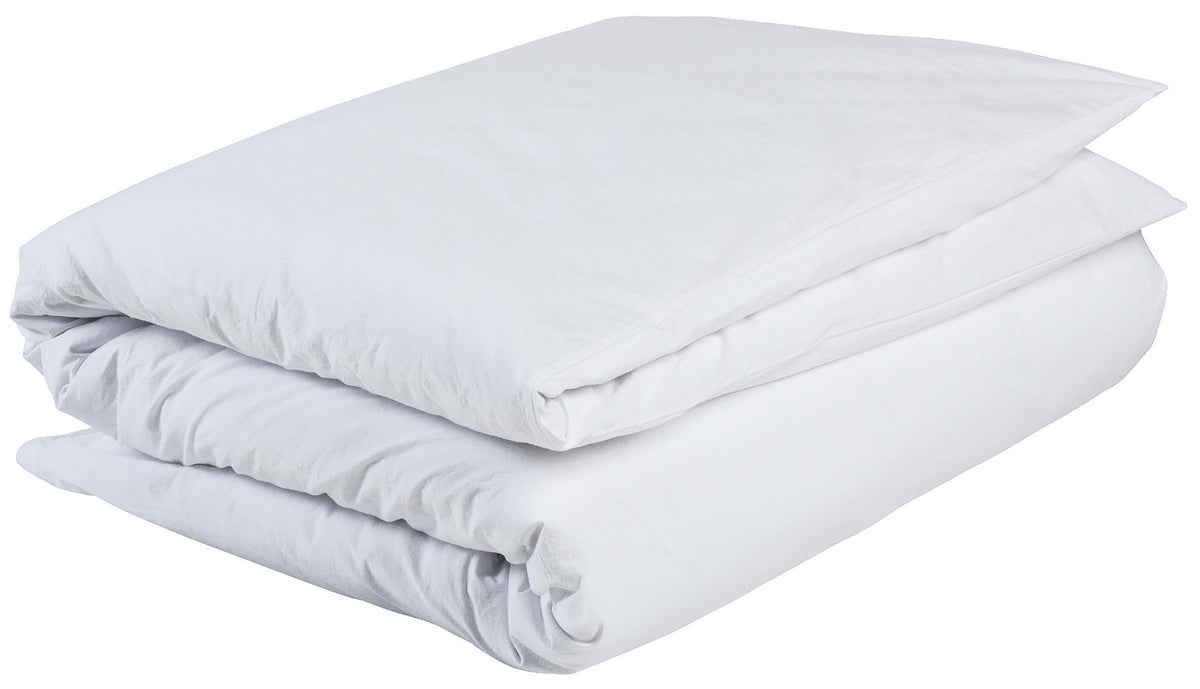 copripiumino celeste milk, colore milk, taglia 140 x 200. copripiumino piegato su sfondo neutro per una visione dettagliata