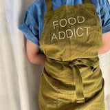 grembiule da cucina per bambini marcel food lichene, colore lichene, taglia 65 x 50. realizzato in 60% lino 40% cotone, resistente e comodo per l’uso quotidiano in cucina