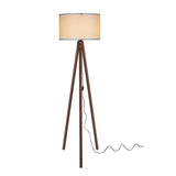 lampada da terra aden asz1460 con piantana in noce e paralume in tessuto crema, vista ambientata accanto a divano, poltrona o libreria
