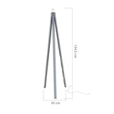 lampada da terra deco mdl3009 treppiede colore grigio, vista ambientata accanto a divano, poltrona o libreria