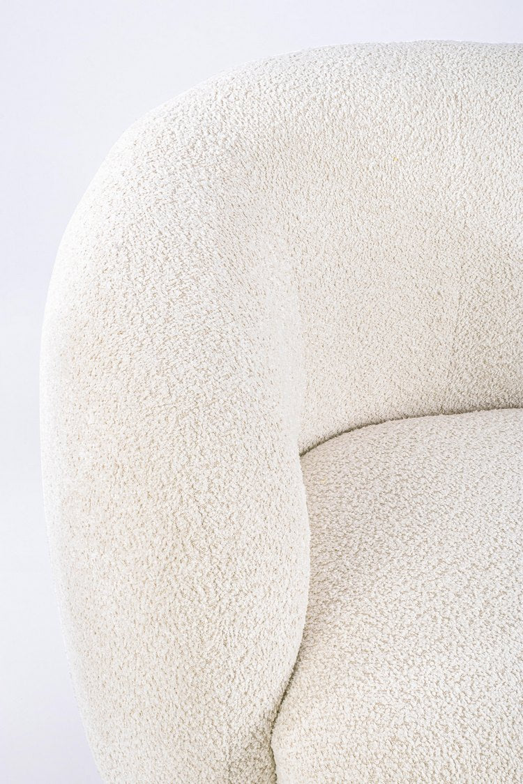 poltrona tecla in tessuto effetto bouclé naturale, design ergonomico per il massimo benessere quotidiano