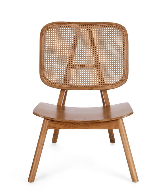 poltrona lounge yves in legno di teak e rattan naturale, vista ambientata in soggiorno o angolo lettura